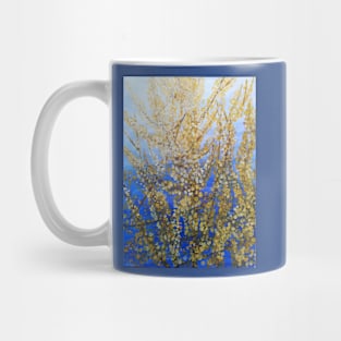 Yellow forsythia blossom against a blue background Mug